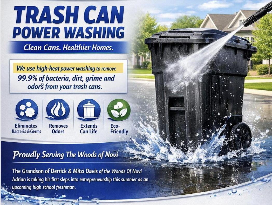 Black residential trash can being power washed with high-pressure water spray